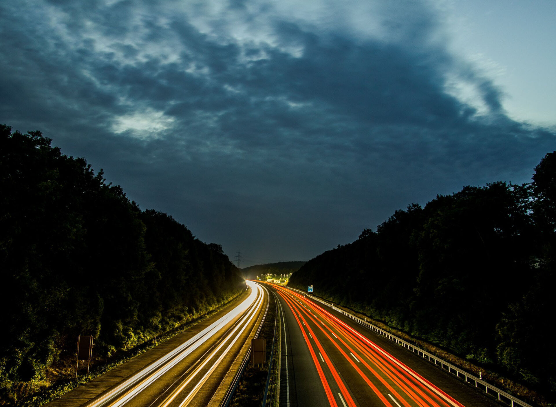 Slow shutter image of a highway and car lights